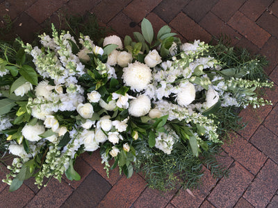 Textured white and grey casket cover