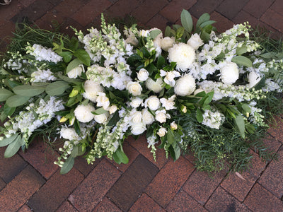 Textured white and grey casket cover