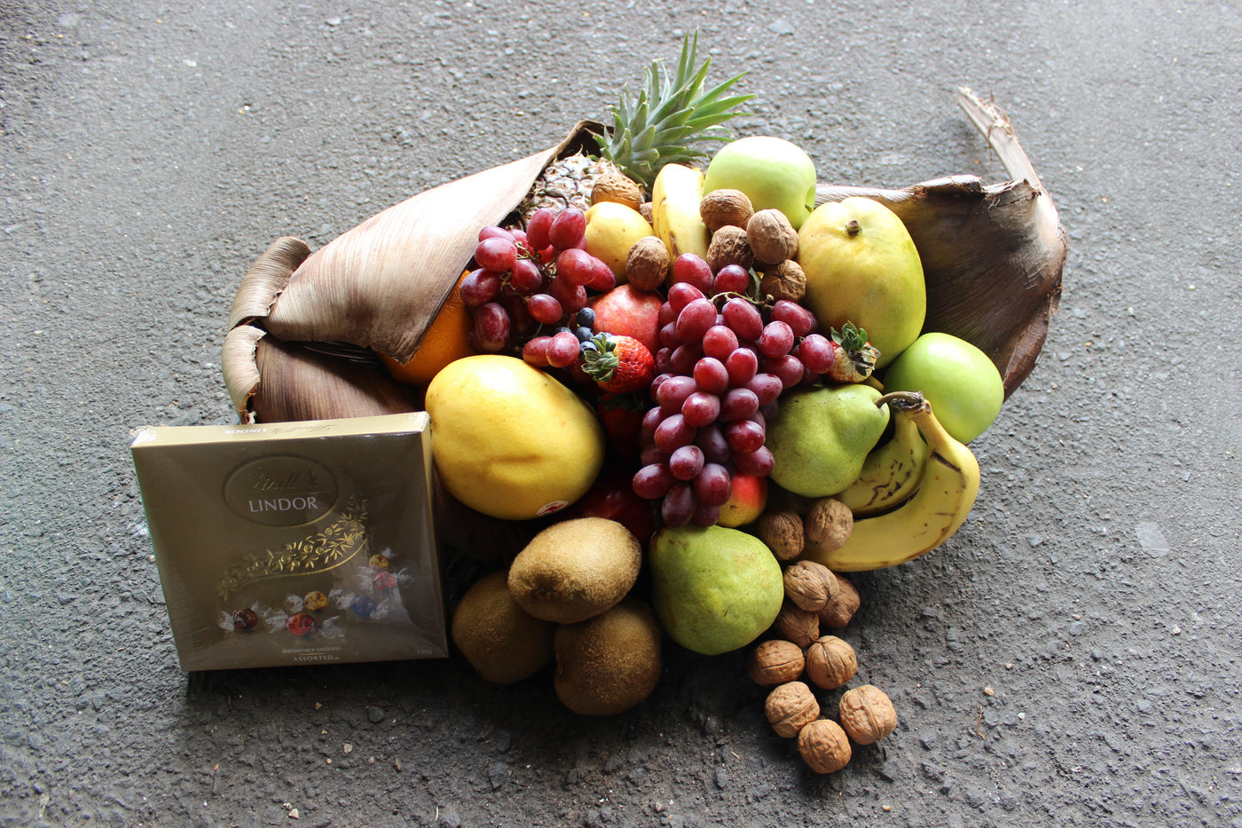 Fruit husk hamper with nuts and chocolates