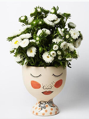 Face vase and flowers